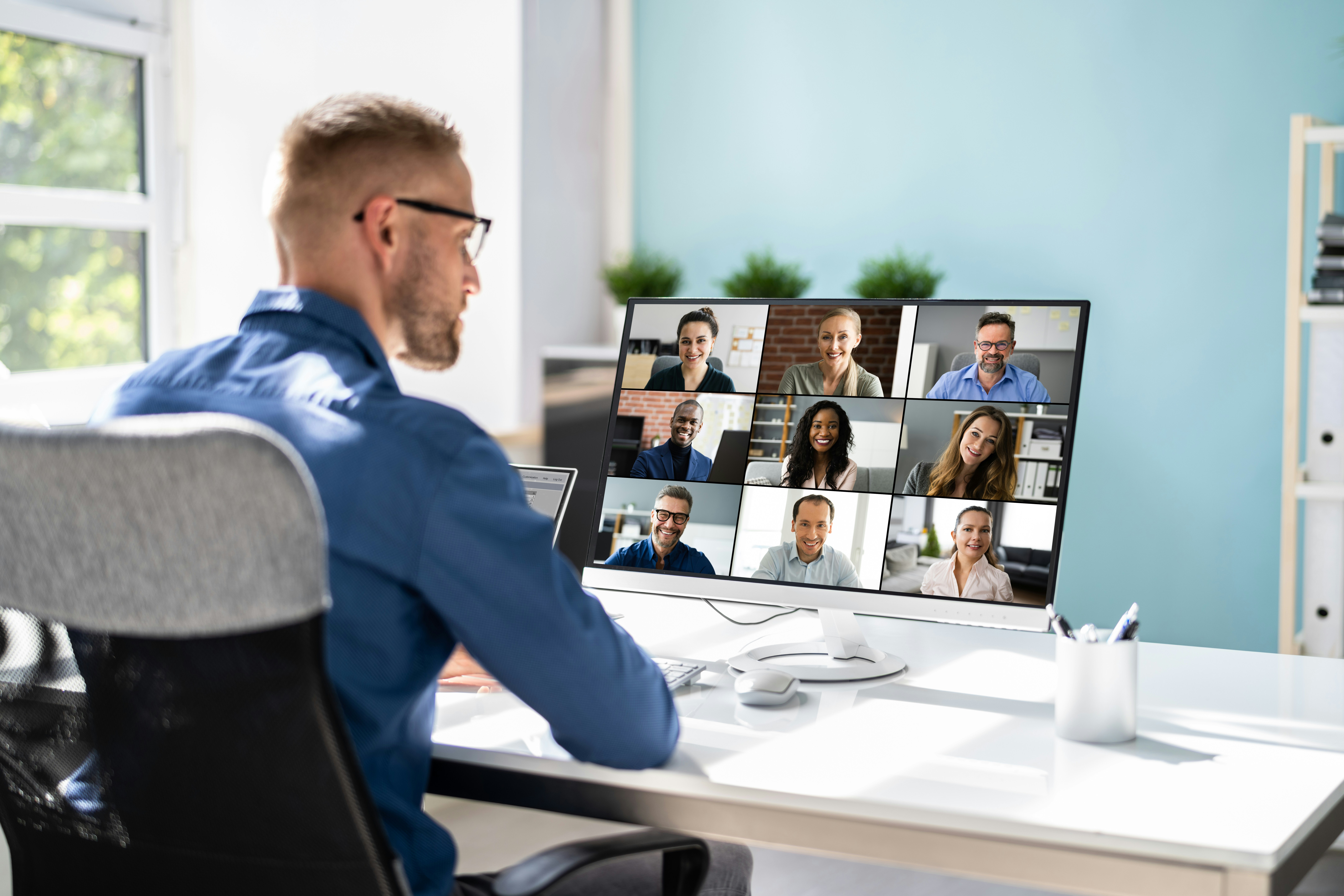 A leader engaging with multiple staff virtually