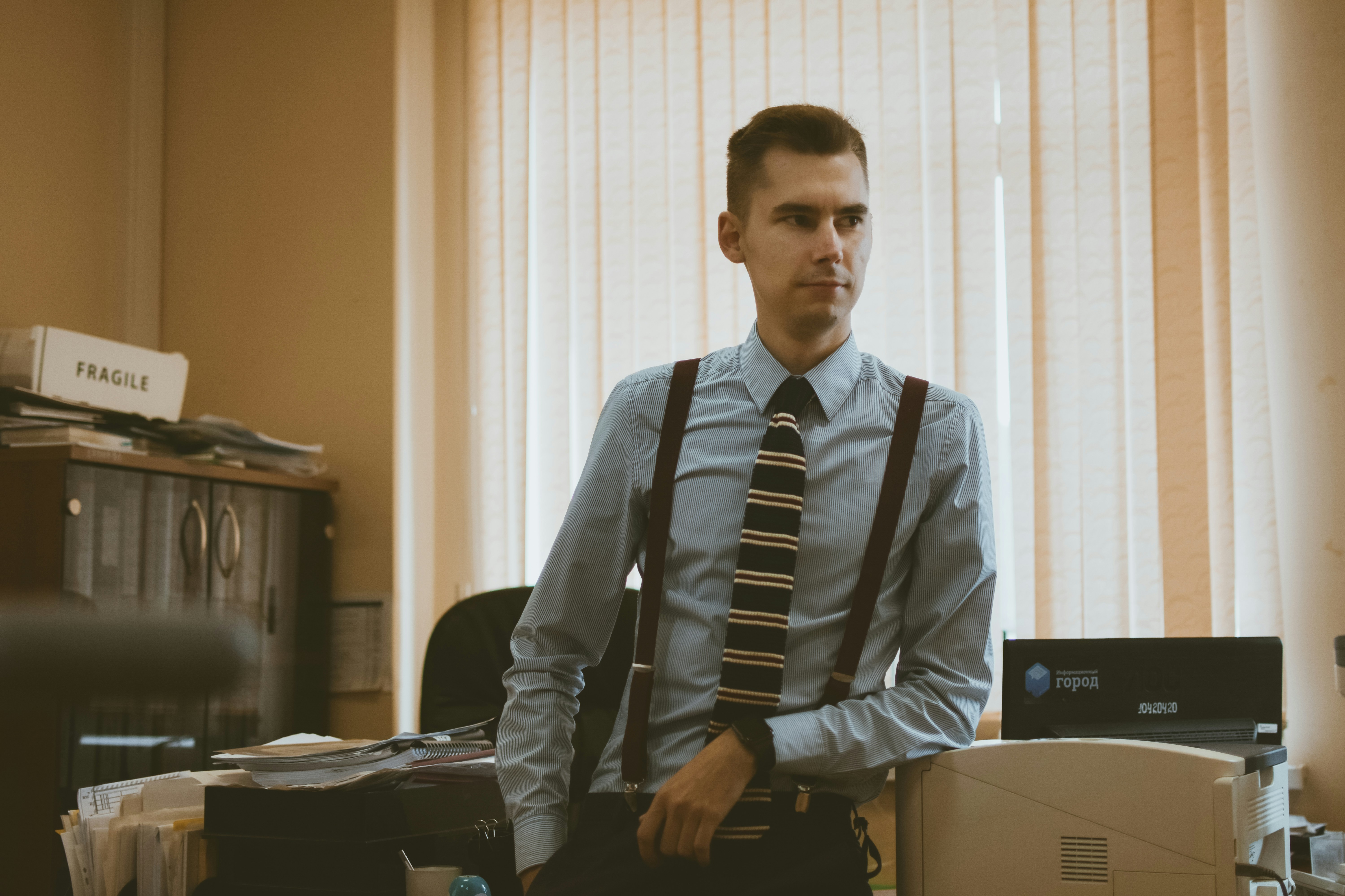 a senior professional looking outward across the office