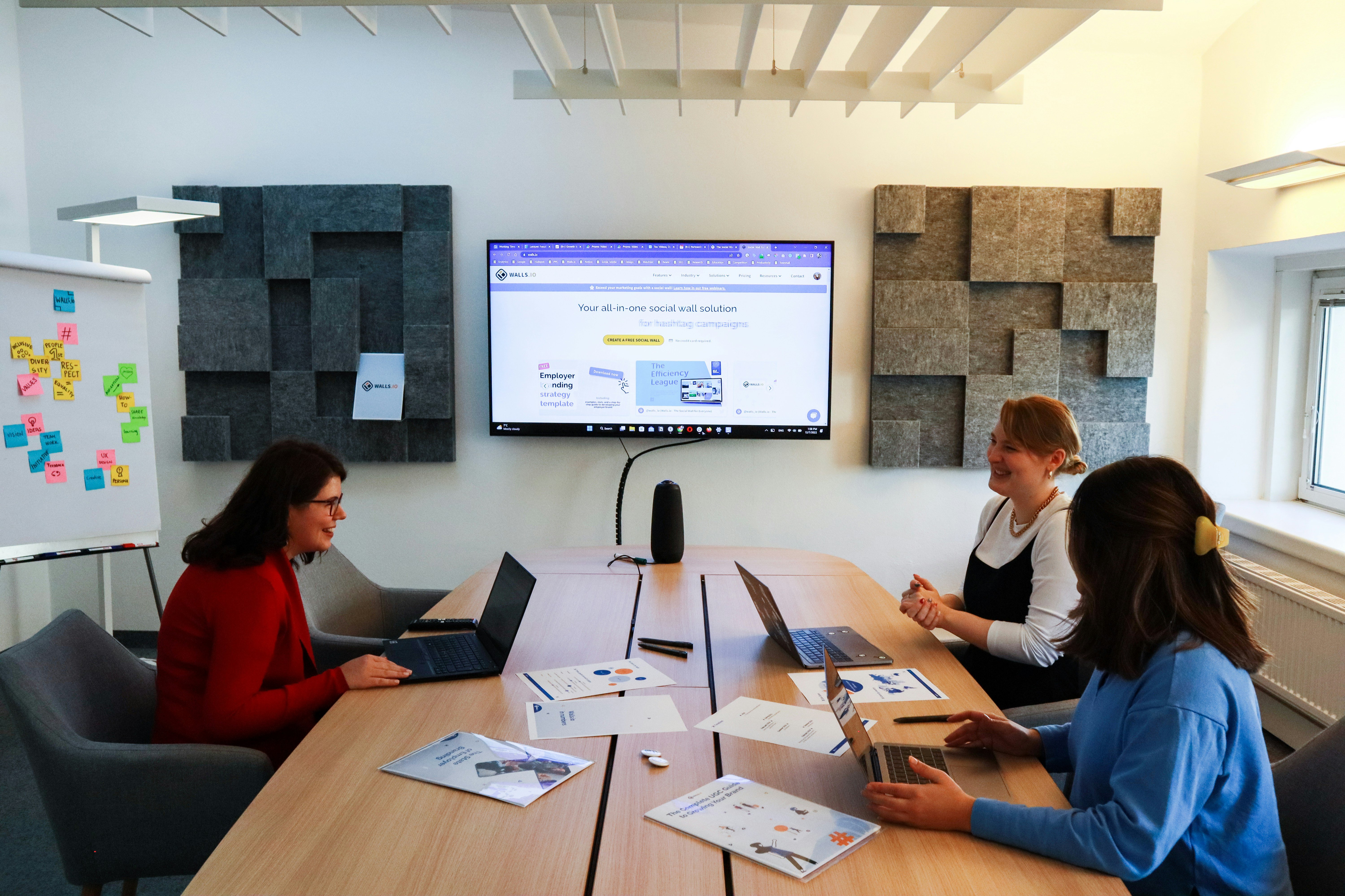 a confident hr or people leader presenting survey results on a screen in a modern meeting room.